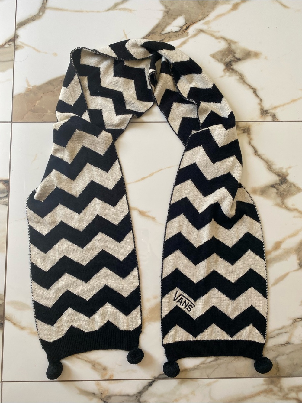 Vans Kookie Chevron Scarf in color black and cream knit with Pom-poms detail
